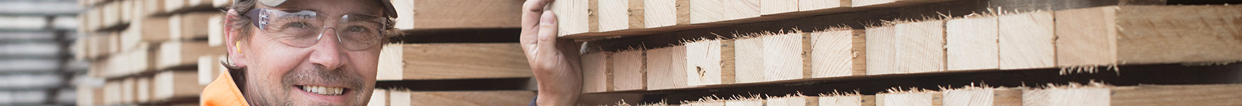 Smiling First Super member working at a timber cutting factory and warehouse