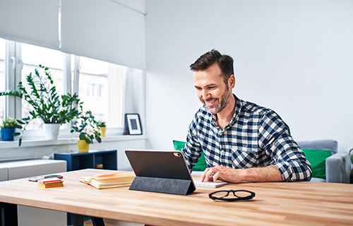 Man working on digital tablet