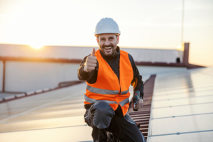 Workman in high vis vest and hard hat giving thumbs up